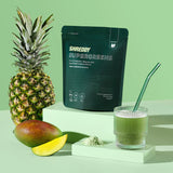 Shreddy Supergreens package with a pineapple, mango, and green smoothie on a green background